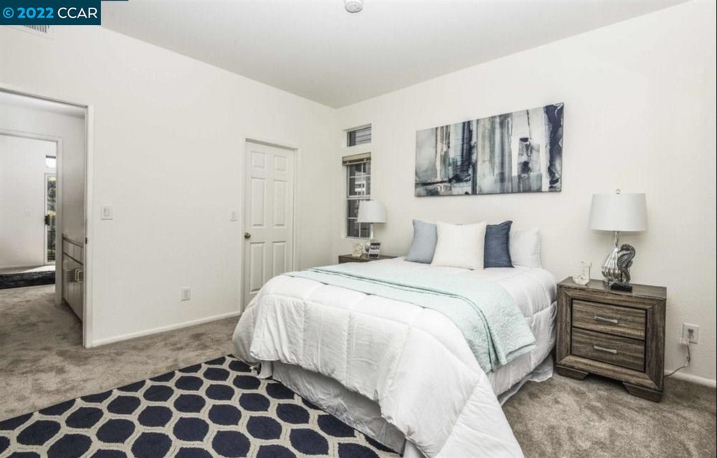 7650 Canyon Meadows Circle Pleasanton, CA 94588 - Photo 18 of 24 a bedroom with a bed and a painting on the wall