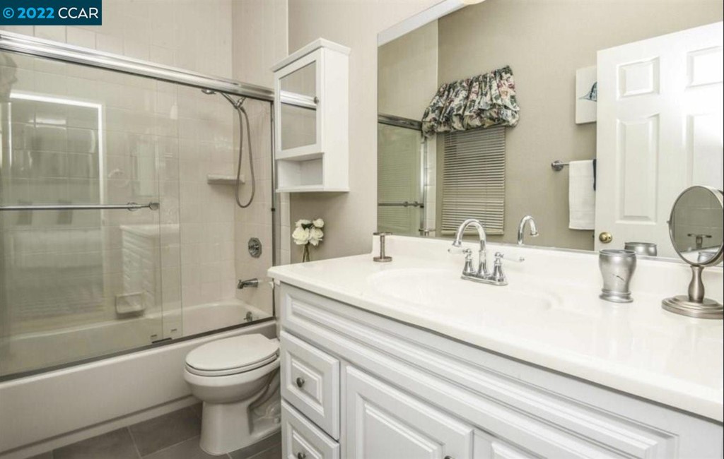 7650 Canyon Meadows Circle Pleasanton, CA 94588 - Photo 19 of 24 a bathroom with a sink a toilet and shower