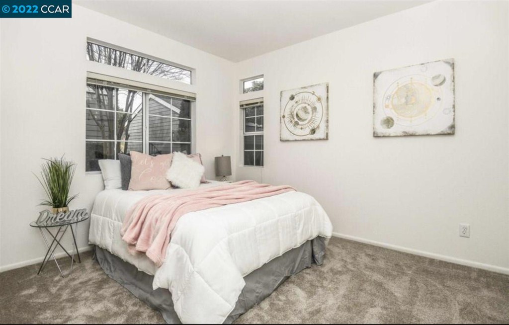 7650 Canyon Meadows Circle Pleasanton, CA 94588 - Photo 20 of 24 a bedroom with a bed and painting on the wall