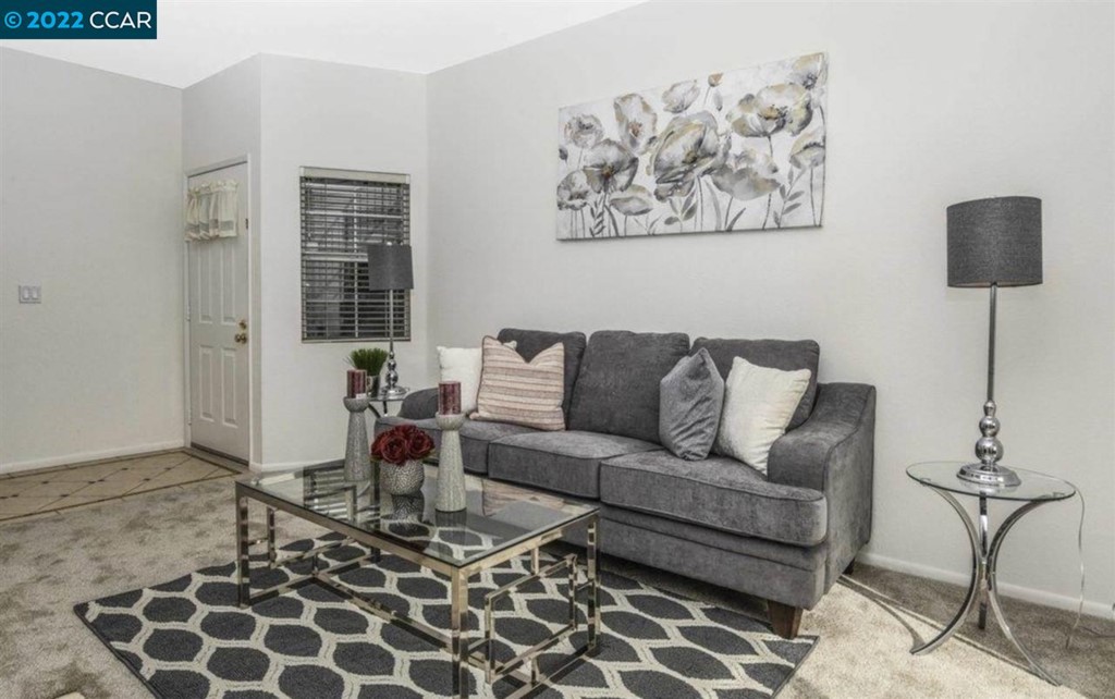 7650 Canyon Meadows Circle Pleasanton, CA 94588 - Photo 6 of 24 a living room with furniture and painting on the wall