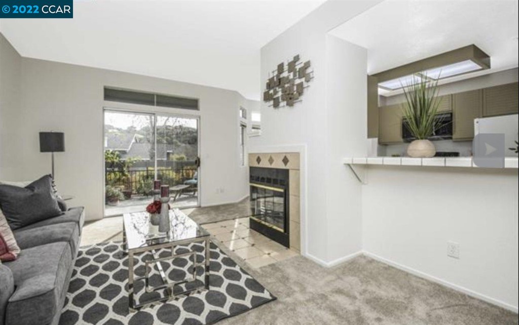 7650 Canyon Meadows Circle Pleasanton, CA 94588 - Photo 9 of 24 a living room with furniture and a fireplace