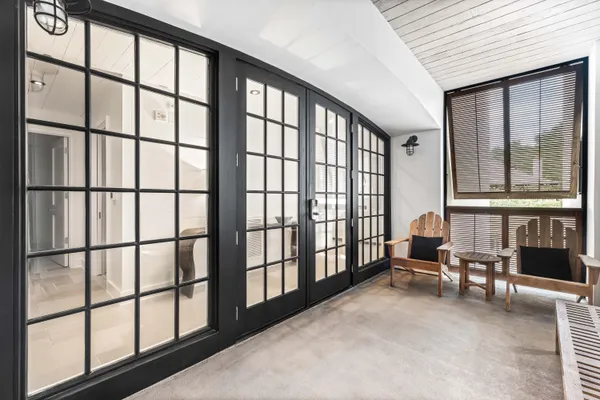 a view of staircase with furniture and large window