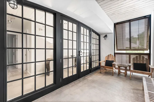 a view of staircase with furniture and large window