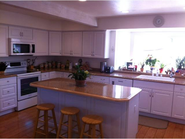 1931 Santa Ana Road Hollister, CA 95023 - Photo 9 of 13 a kitchen with granite countertop a sink stove and cabinets