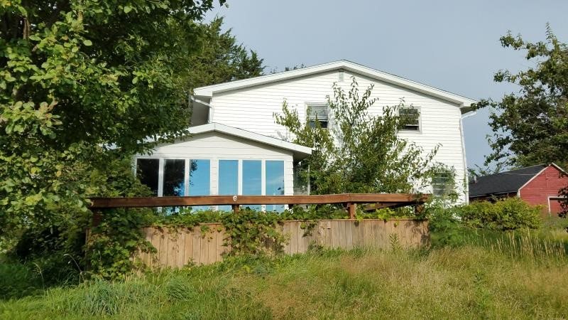 5030 Rotary Road Cherry Valley, IL 61016 - Photo 1 of 5 a front view of a house with garden
