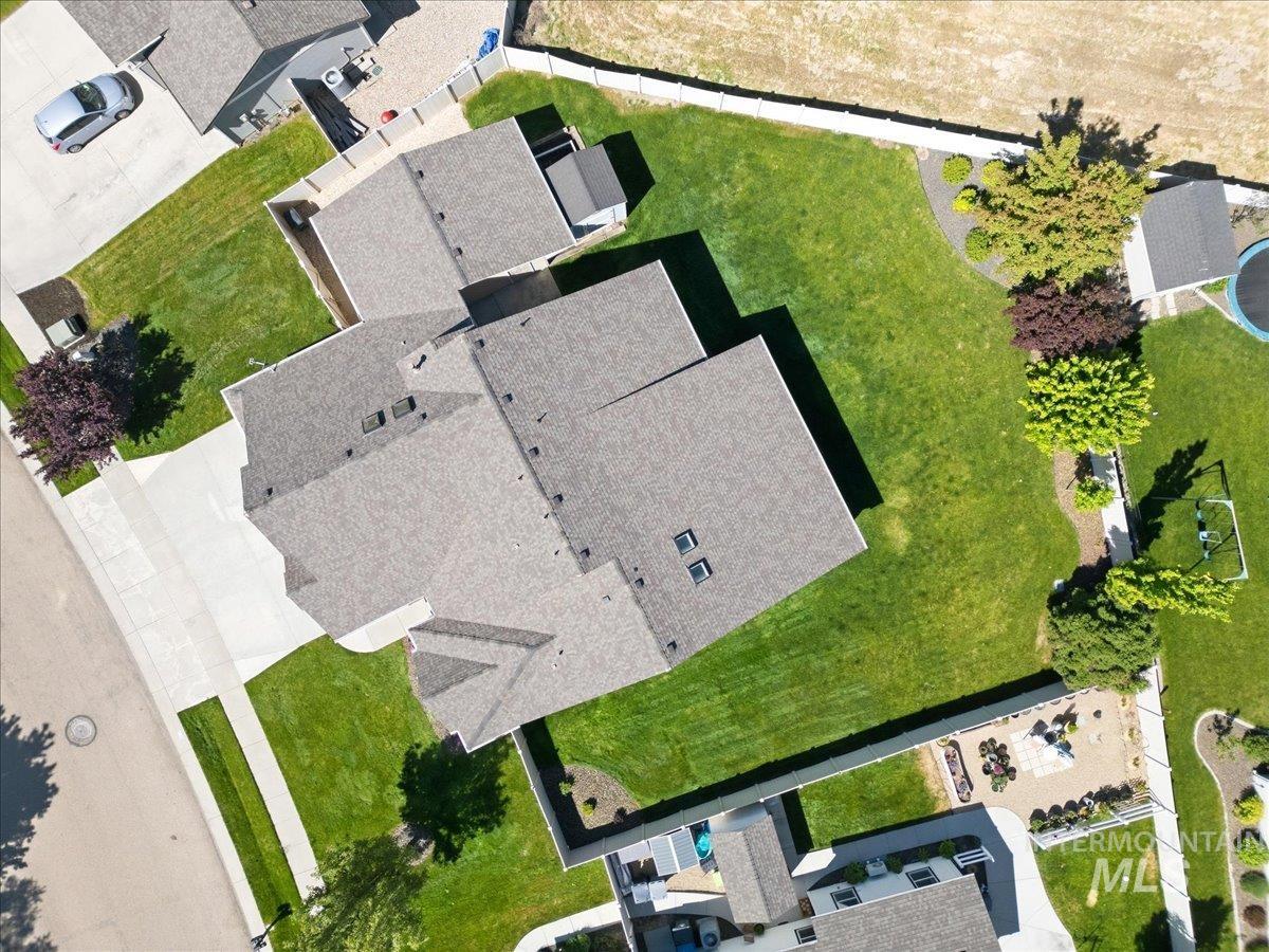 1183 North Buffalo Way Middleton, ID 83644 - Photo 36 of 47 Aerial perspective highlighting a large residential property with a shingle roof and multiple skylights