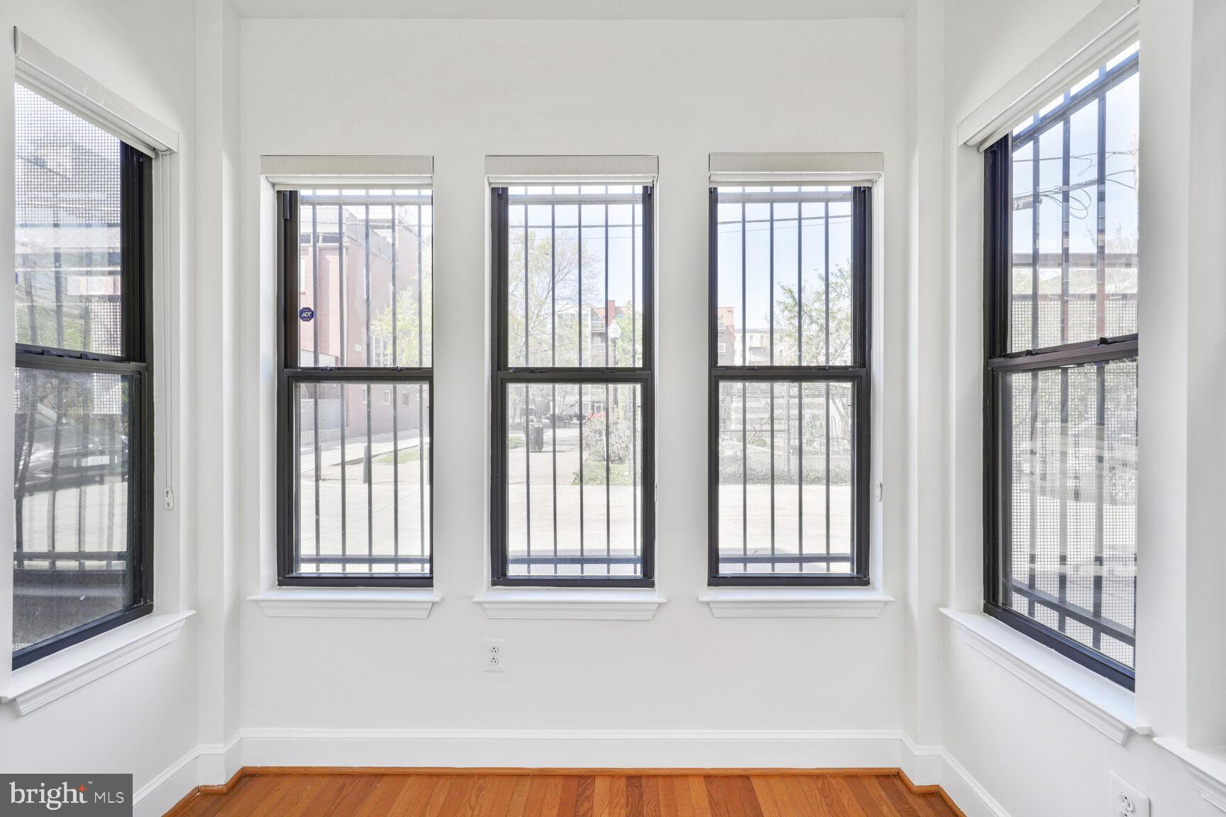 1419 Clifton Street Northwest, Unit 105 Washington, DC 20009 - Photo 11 of 19 a view of an empty room with windows