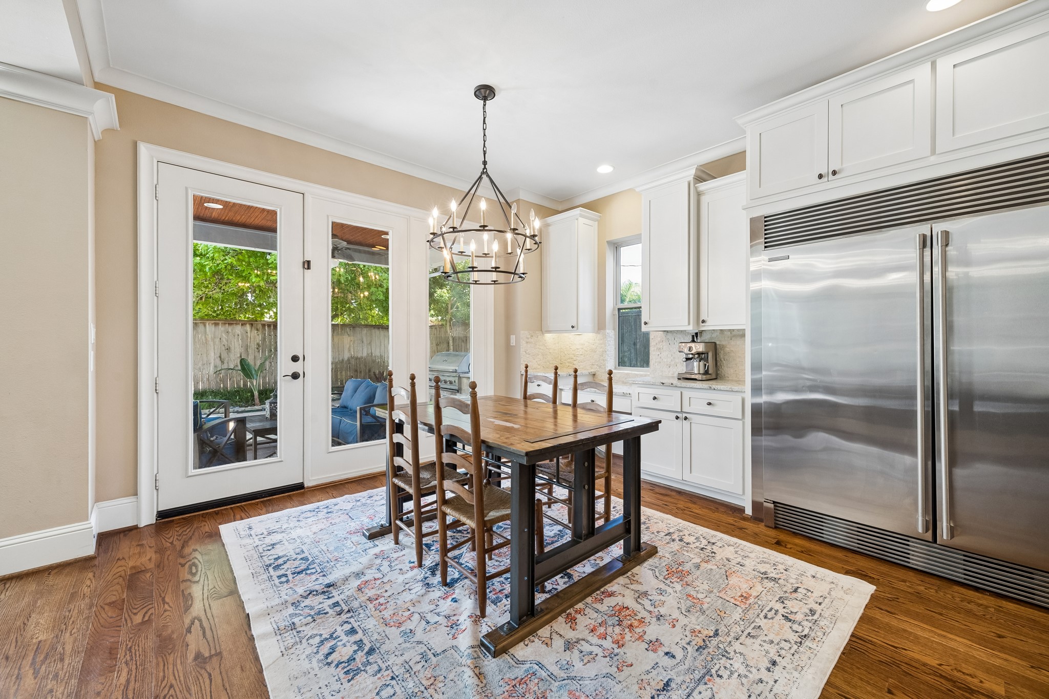 1360 Chippendale Road Houston, TX 77018 - Photo 11 of 34 Bright breakfast area surrounded by natural light and positioned perfectly between the kitchen and backyard entertaining spaces. Large windows overlook the pool area while an exterior door provides direct access to the covered patio and summer kitchen.