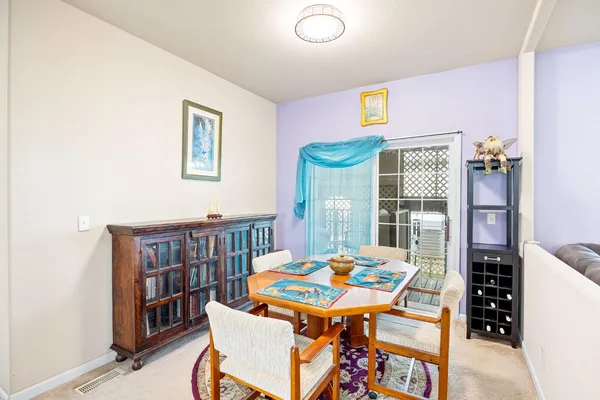 a bedroom with a bed and a table in it