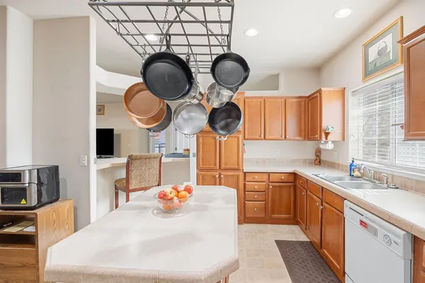 a kitchen with a sink cabinets and appliances