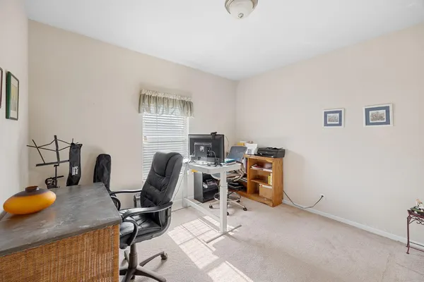 a workspace with furniture and lamp