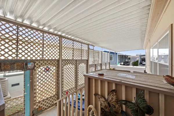 a view of balcony with furniture