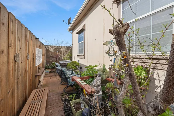 a backyard of a house with outdoor seating