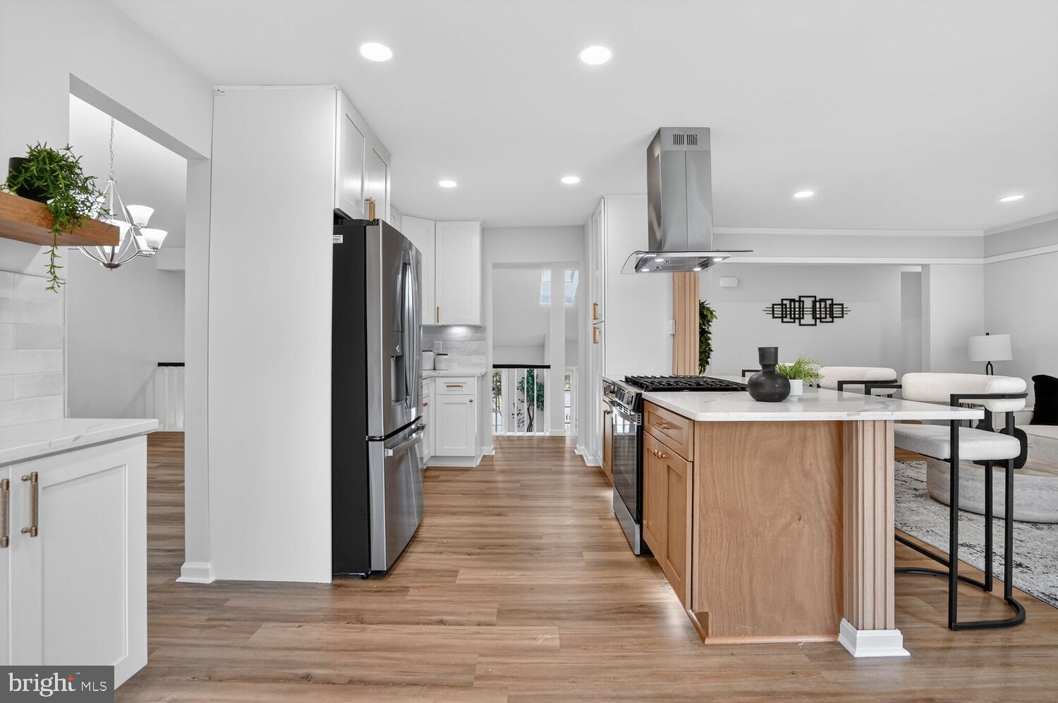 9217 Dorothy Lane Springfield, VA 22153 - Photo 11 of 58 a kitchen with stainless steel appliances granite countertop a refrigerator a sink dishwasher and a oven with wooden floor