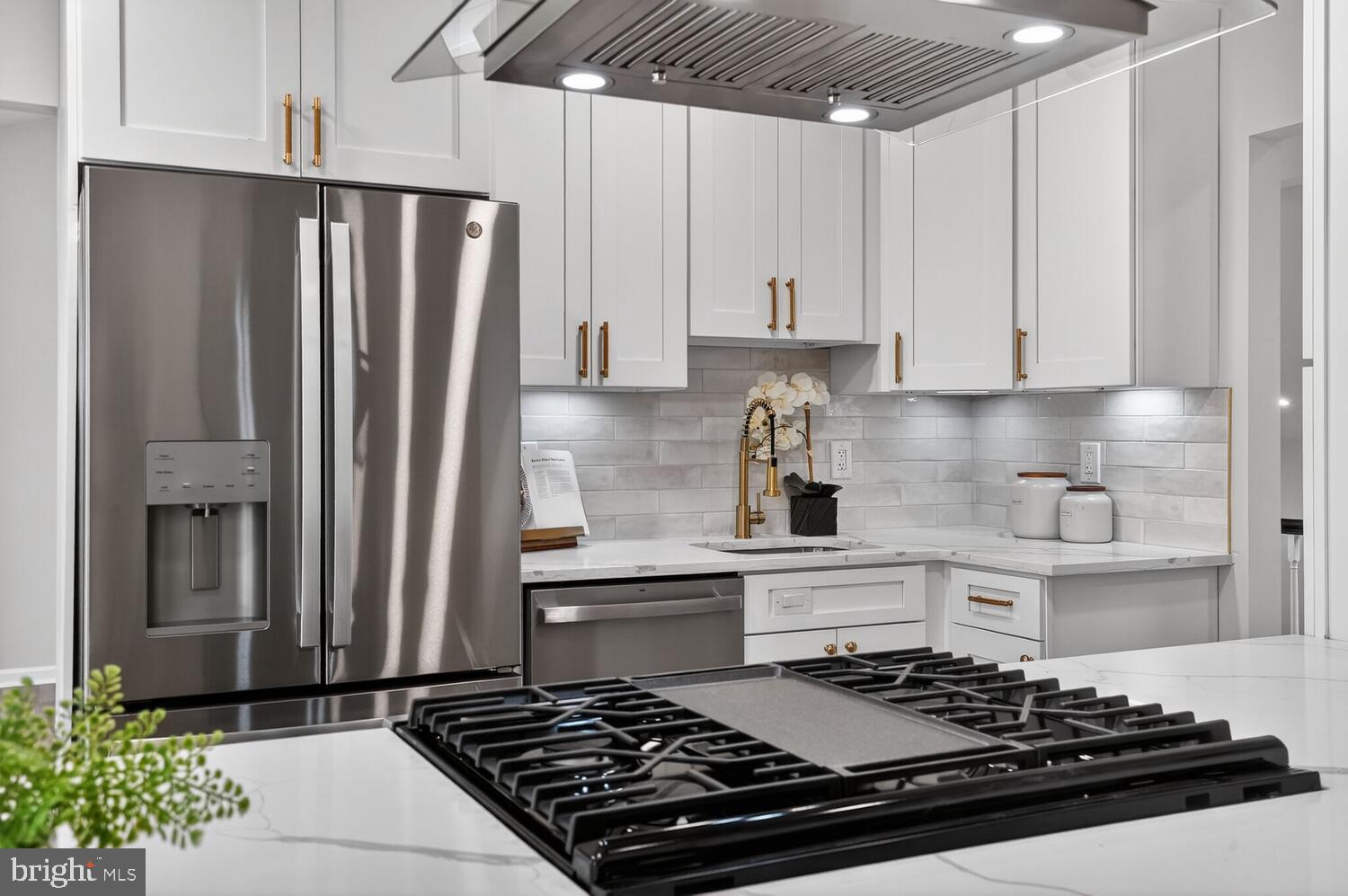 9217 Dorothy Lane Springfield, VA 22153 - Photo 12 of 58 a kitchen with stainless steel appliances granite countertop a stove and a refrigerator