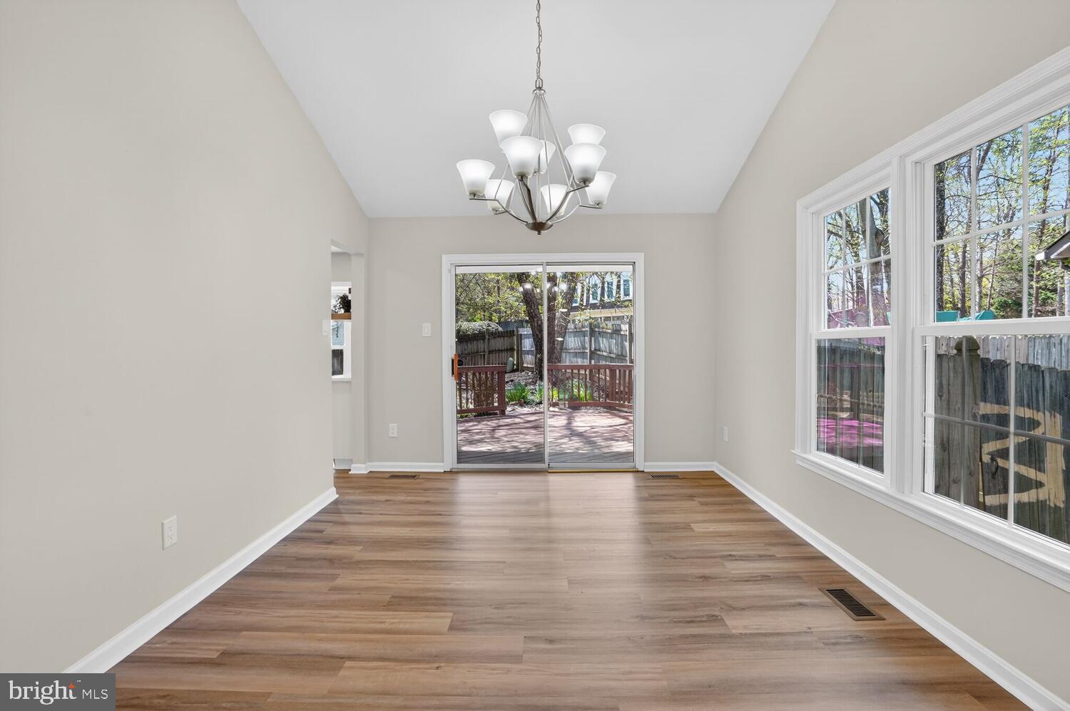 9217 Dorothy Lane Springfield, VA 22153 - Photo 14 of 58 a view of an empty room with wooden floor and a window
