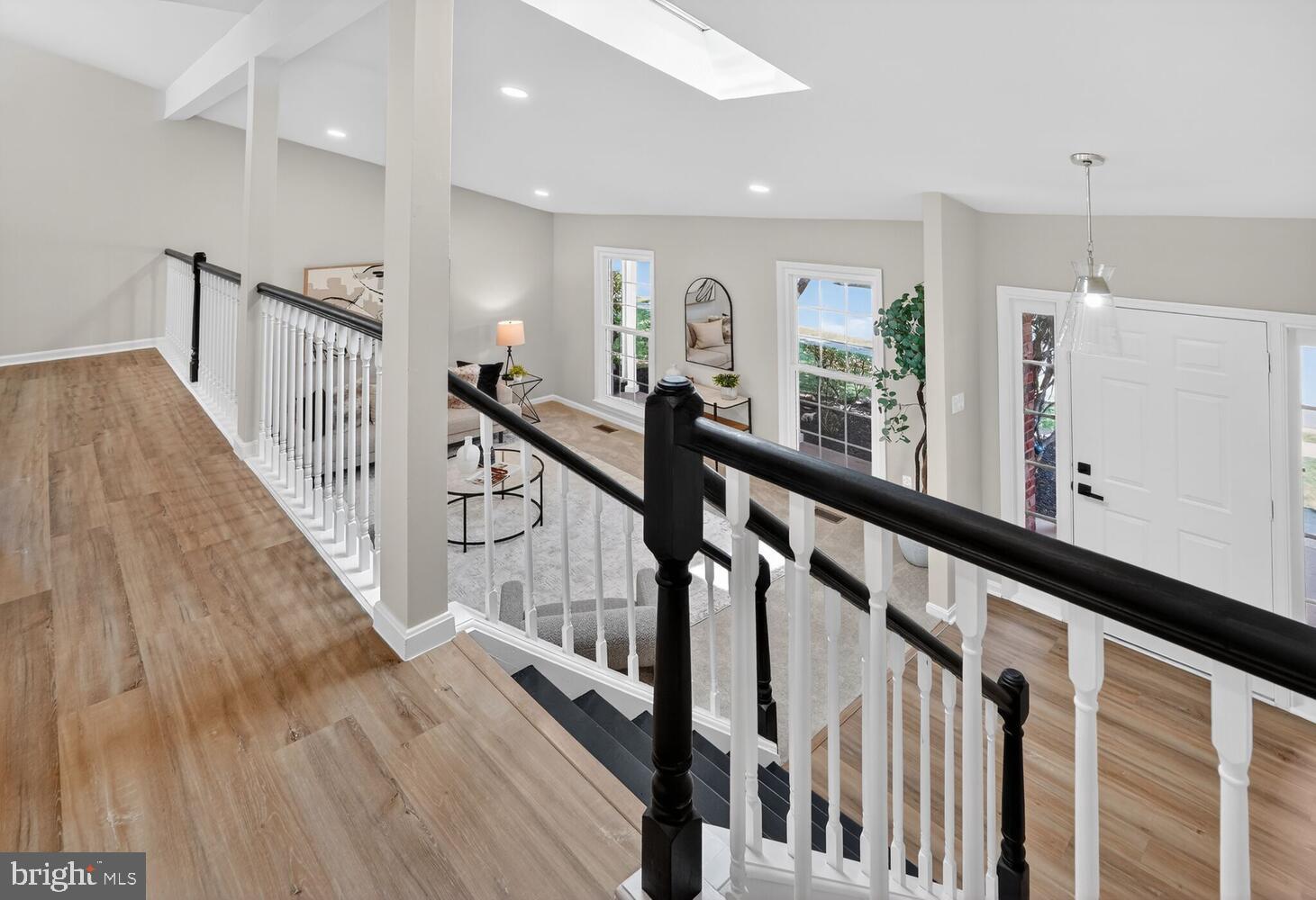 9217 Dorothy Lane Springfield, VA 22153 - Photo 18 of 58 a view of a hallway with wooden floor and staircase