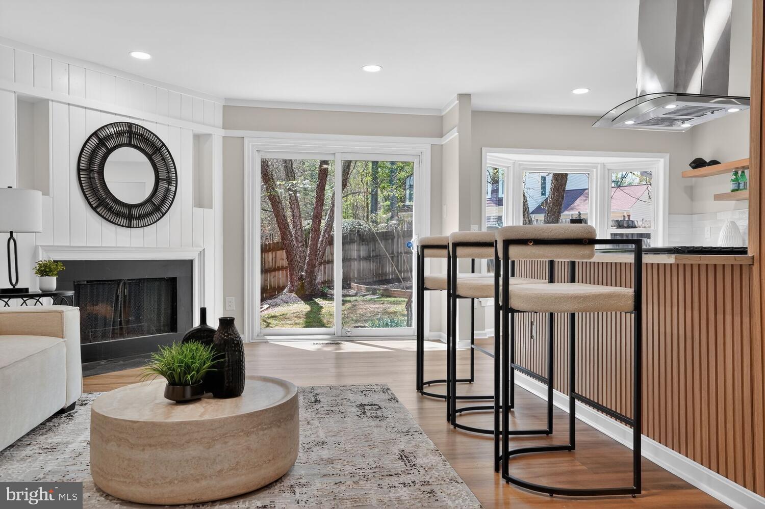 9217 Dorothy Lane Springfield, VA 22153 - Photo 21 of 58 a living room with fireplace furniture and a large window