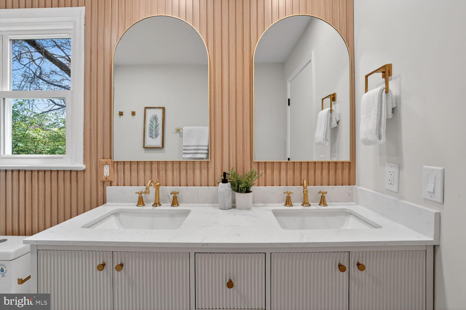 9217 Dorothy Lane Springfield, VA 22153 - Photo 32 of 58 a bathroom with a sink and a mirror