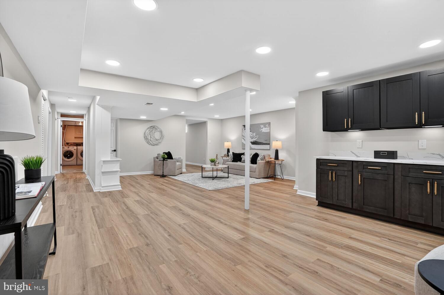 9217 Dorothy Lane Springfield, VA 22153 - Photo 39 of 58 a large kitchen with stainless steel appliances kitchen island granite countertop a large counter top space a sink and cabinets