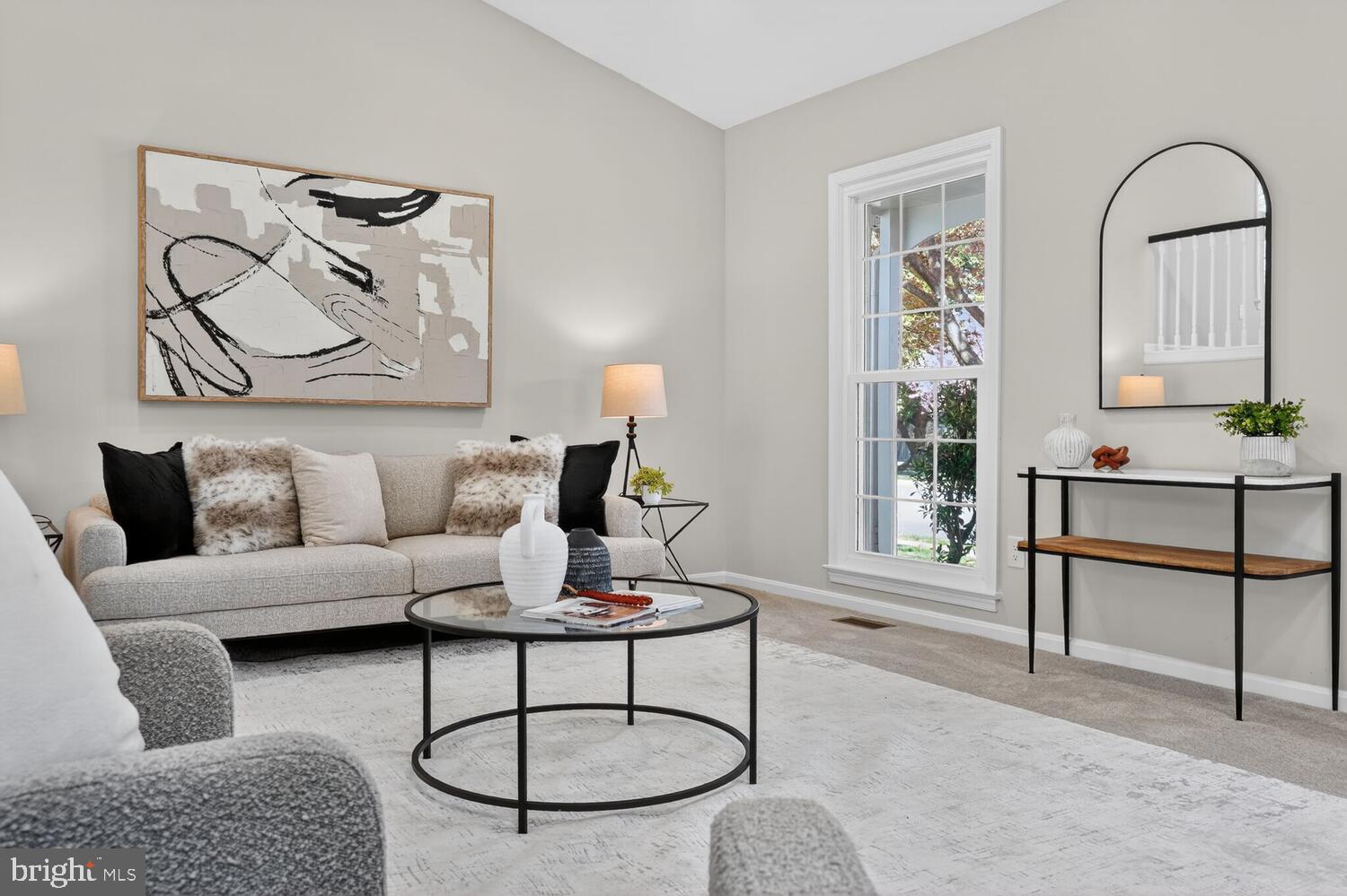 9217 Dorothy Lane Springfield, VA 22153 - Photo 5 of 58 a living room with furniture a rug and a painting on the wall