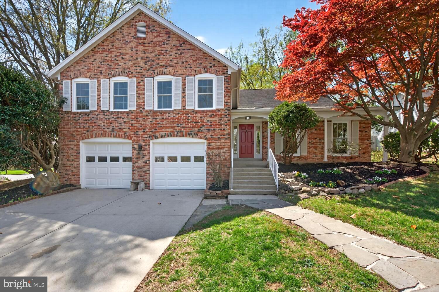 9217 Dorothy Lane Springfield, VA 22153 - Photo 51 of 58 a front view of a house with a yard and garage