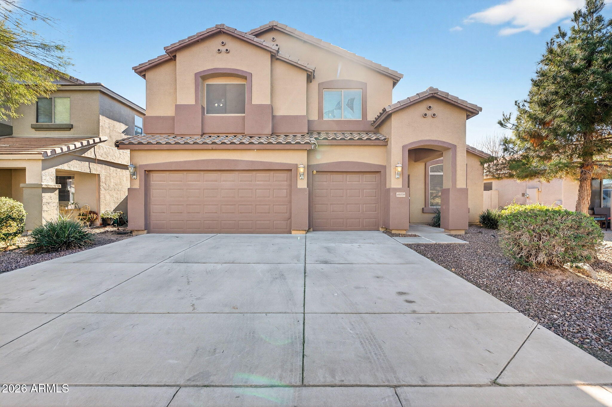 46039 West Amsterdam Road Maricopa, AZ 85139 - Photo 1 of 61 a view of a house with a yard and garage