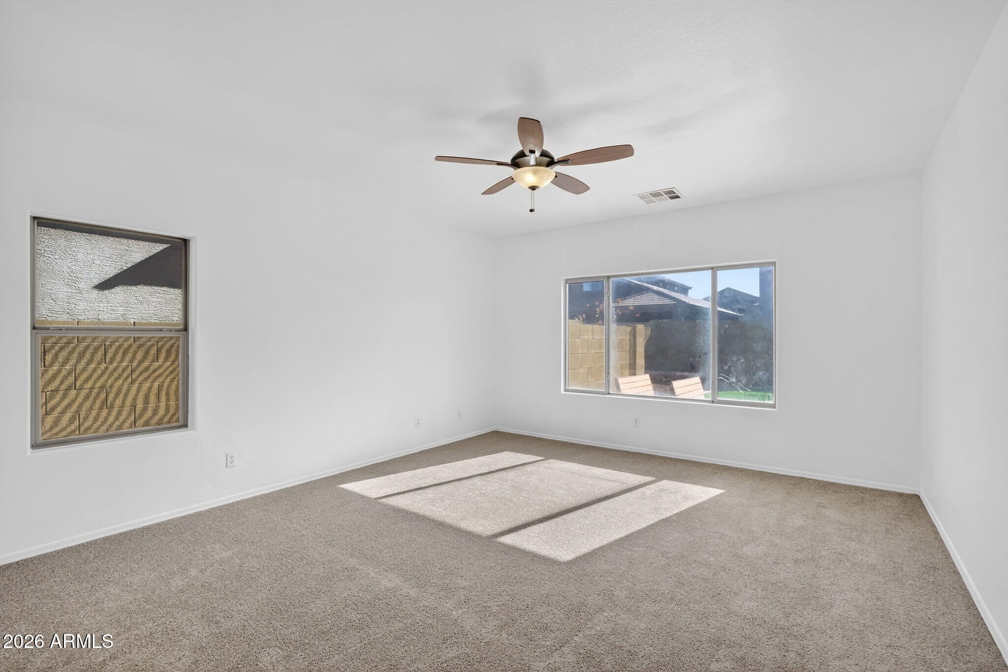 46039 West Amsterdam Road Maricopa, AZ 85139 - Photo 18 of 61 a view of an empty room with a window