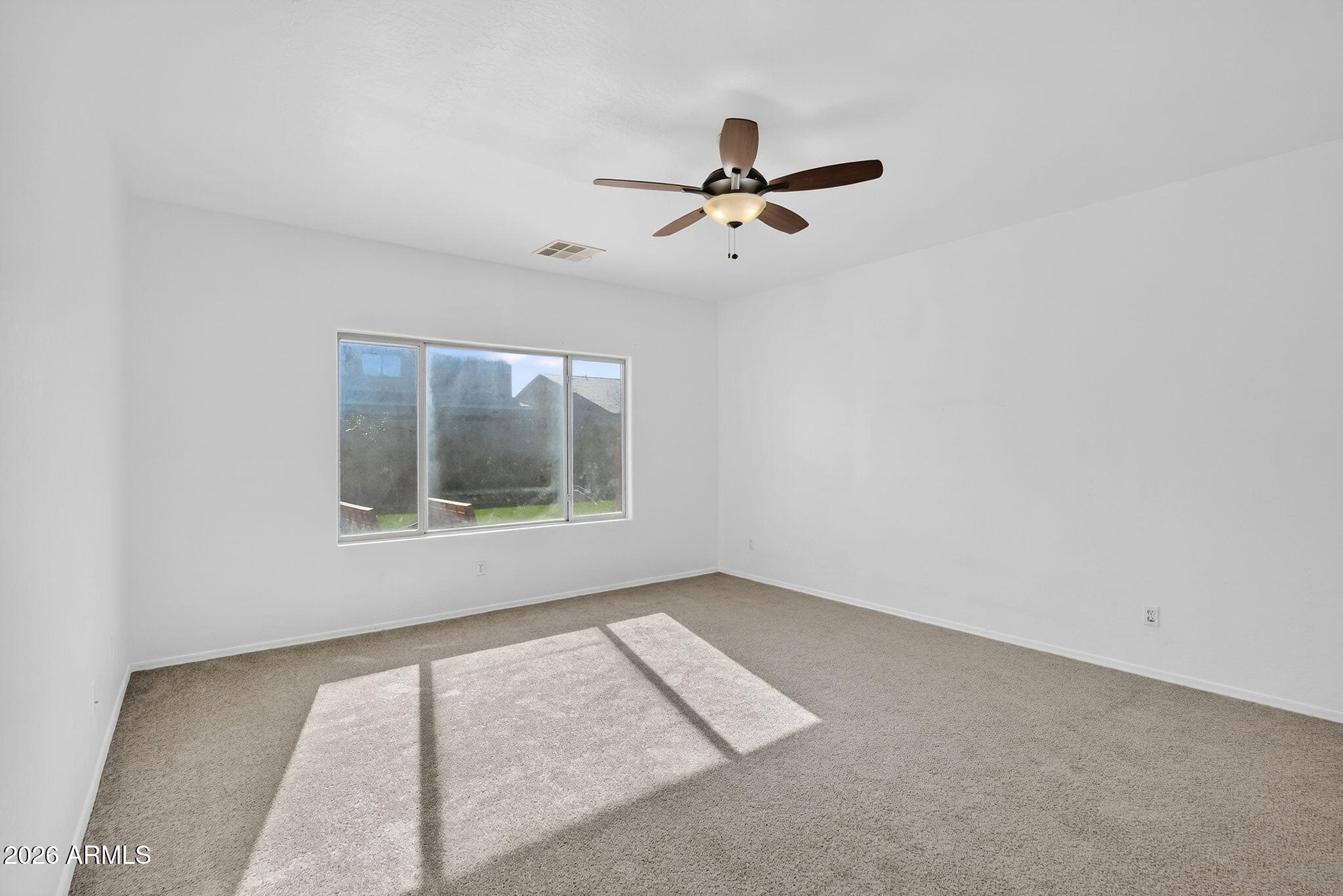 46039 West Amsterdam Road Maricopa, AZ 85139 - Photo 19 of 61 a view of an empty room with a window