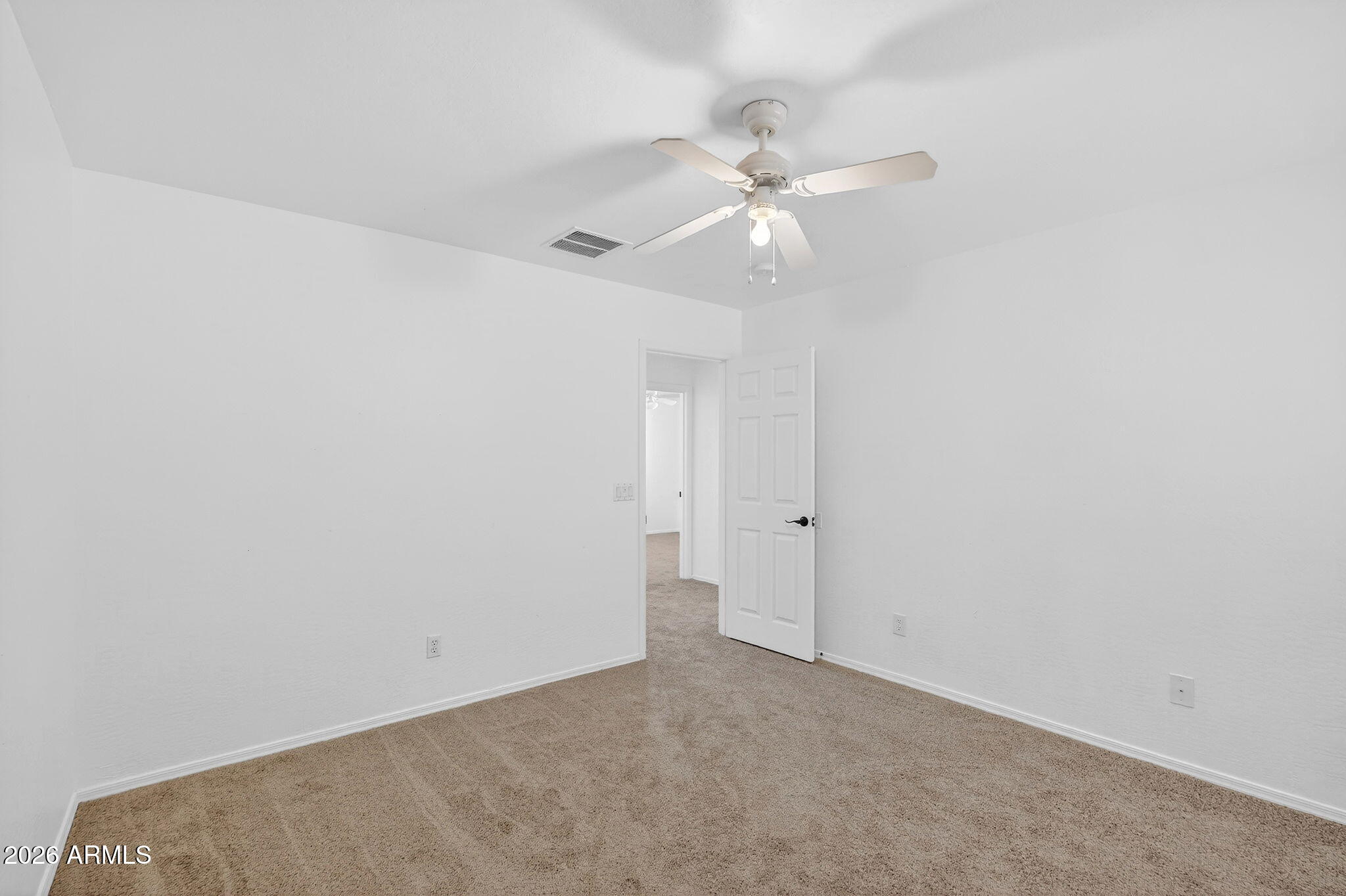 46039 West Amsterdam Road Maricopa, AZ 85139 - Photo 36 of 61 an empty room with a window and a fan