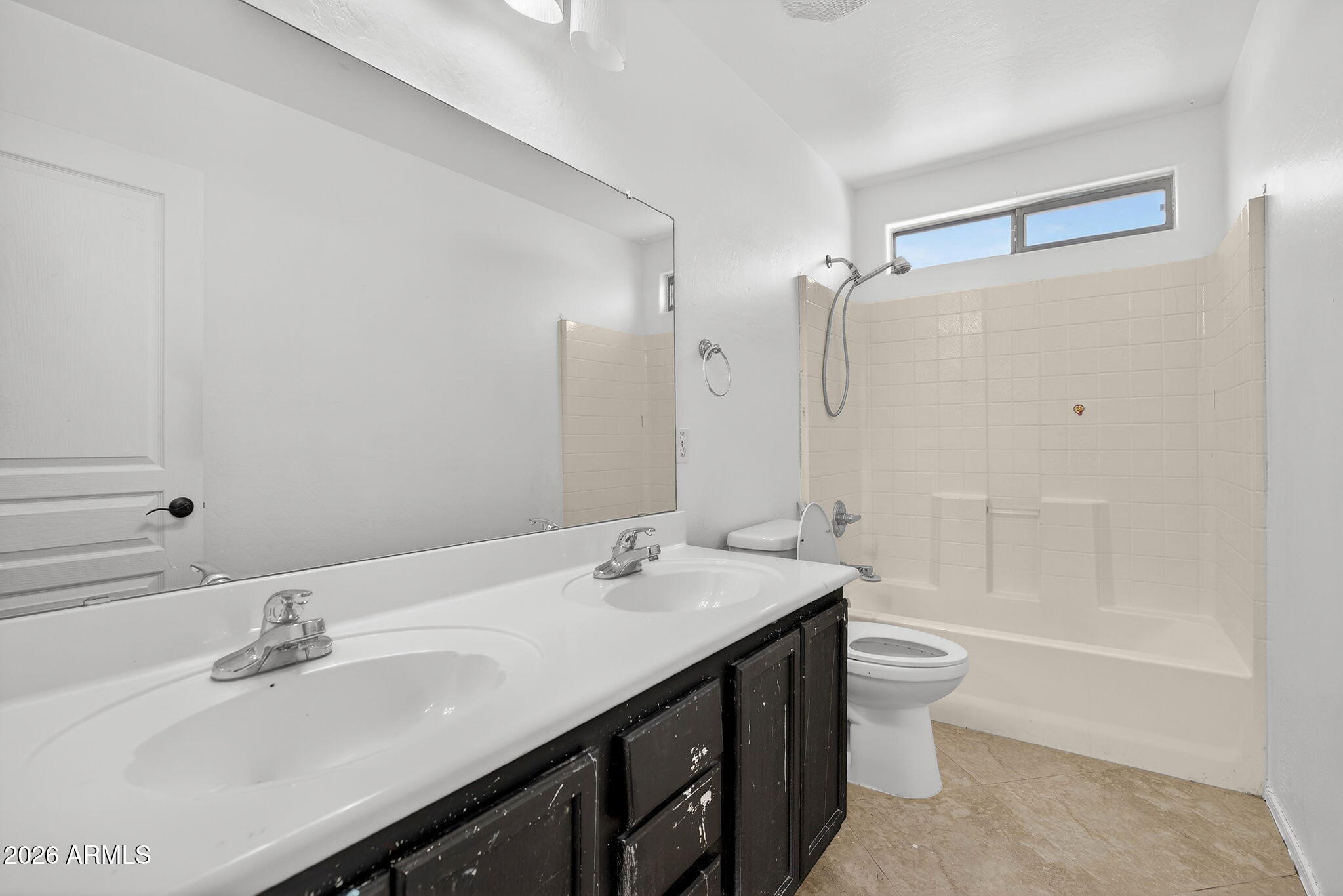 46039 West Amsterdam Road Maricopa, AZ 85139 - Photo 39 of 61 a bathroom with a double vanity sink and a mirror