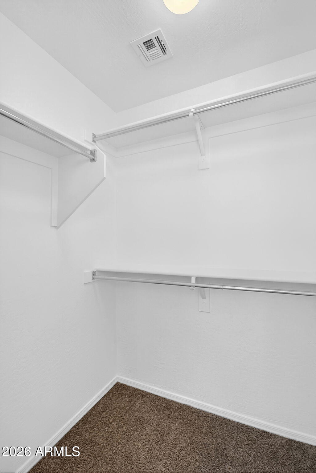 46039 West Amsterdam Road Maricopa, AZ 85139 - Photo 41 of 61 a view of an empty walk in closet