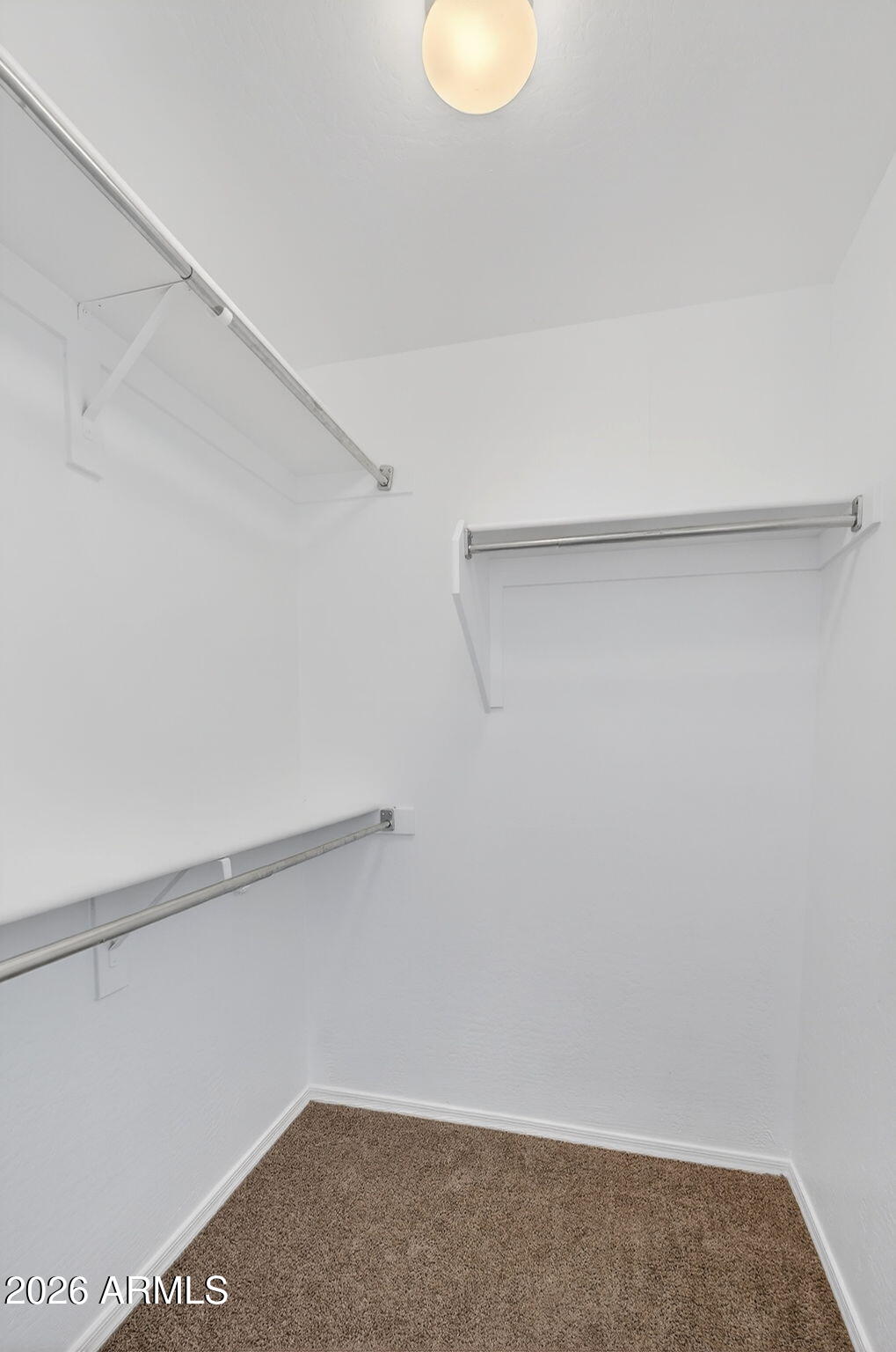 46039 West Amsterdam Road Maricopa, AZ 85139 - Photo 43 of 61 a view of small space with racks on the wall