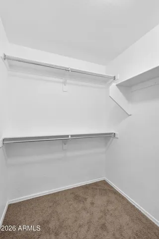 a view of a house with backyard porch and sitting area