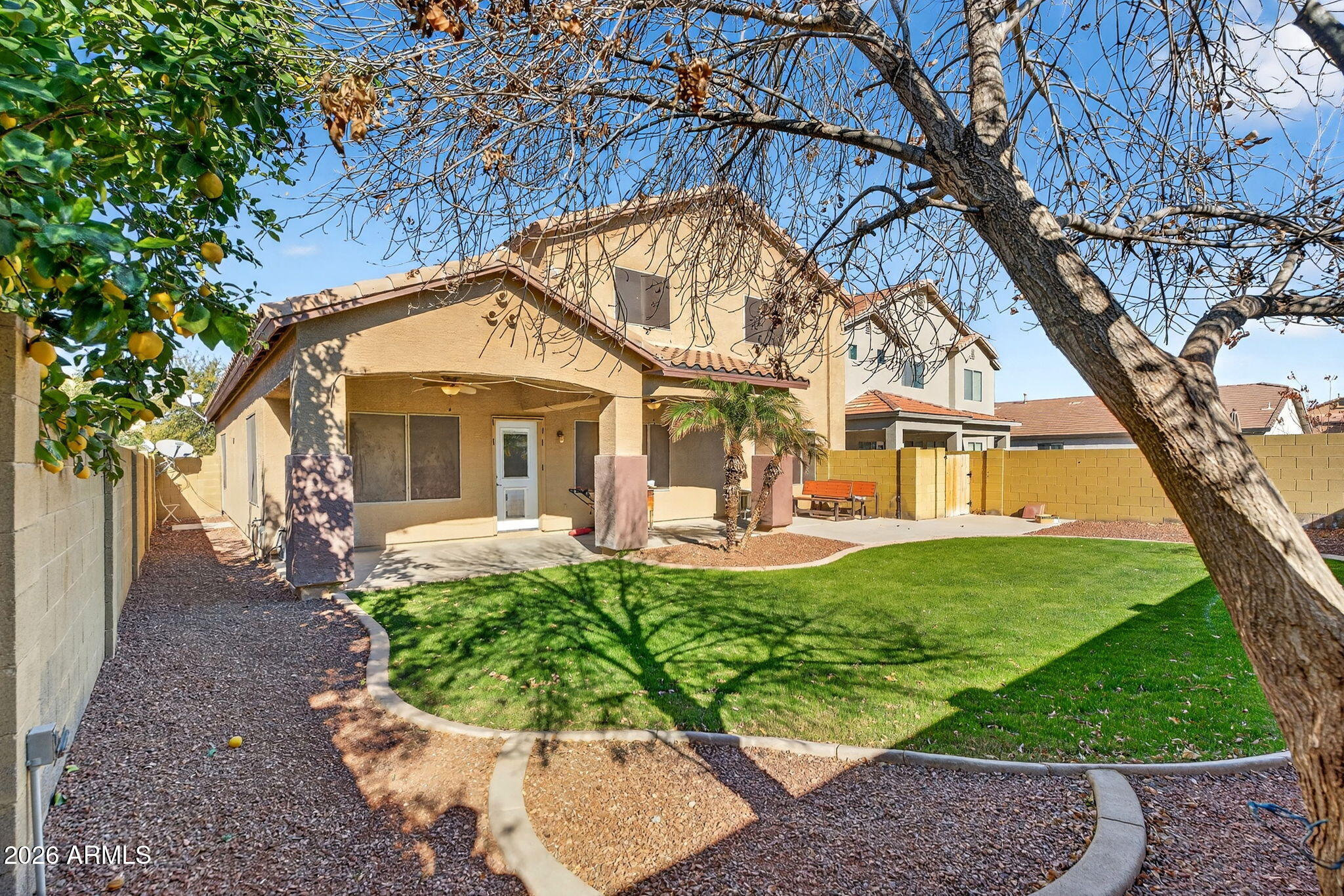 46039 West Amsterdam Road Maricopa, AZ 85139 - Photo 49 of 61 a front view of a house with a yard