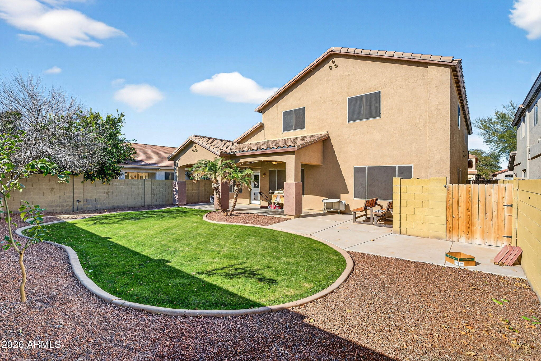 46039 West Amsterdam Road Maricopa, AZ 85139 - Photo 50 of 61 a view of a house with backyard porch and sitting area
