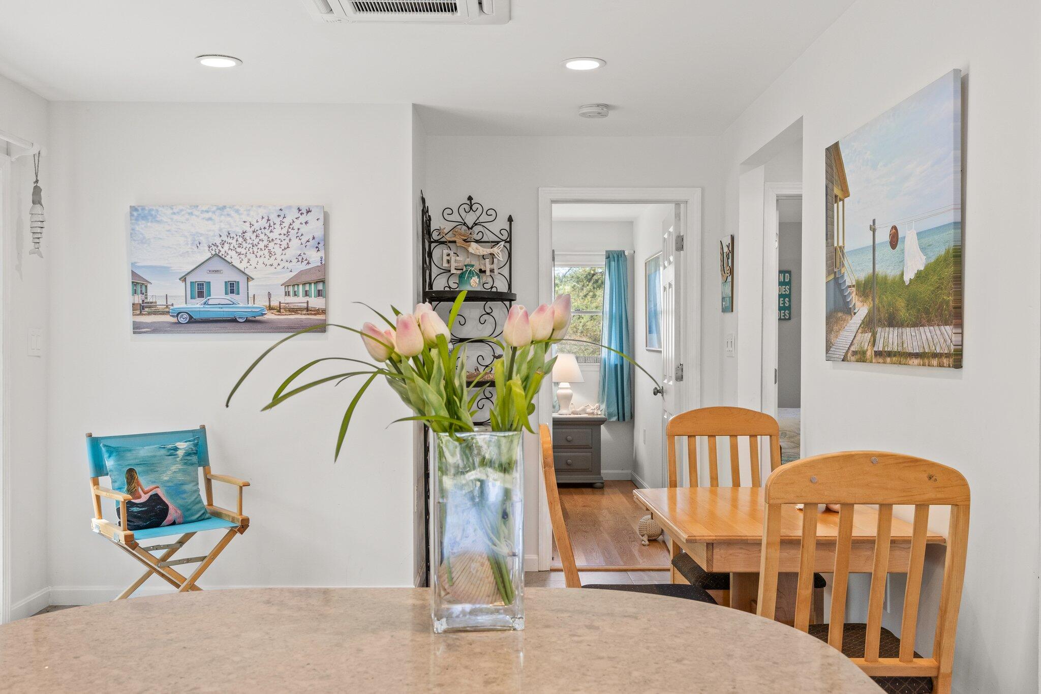 19 South Highland Road Truro, MA 02666 - Photo 13 of 45 a living room filled with furniture and paintings on the wall
