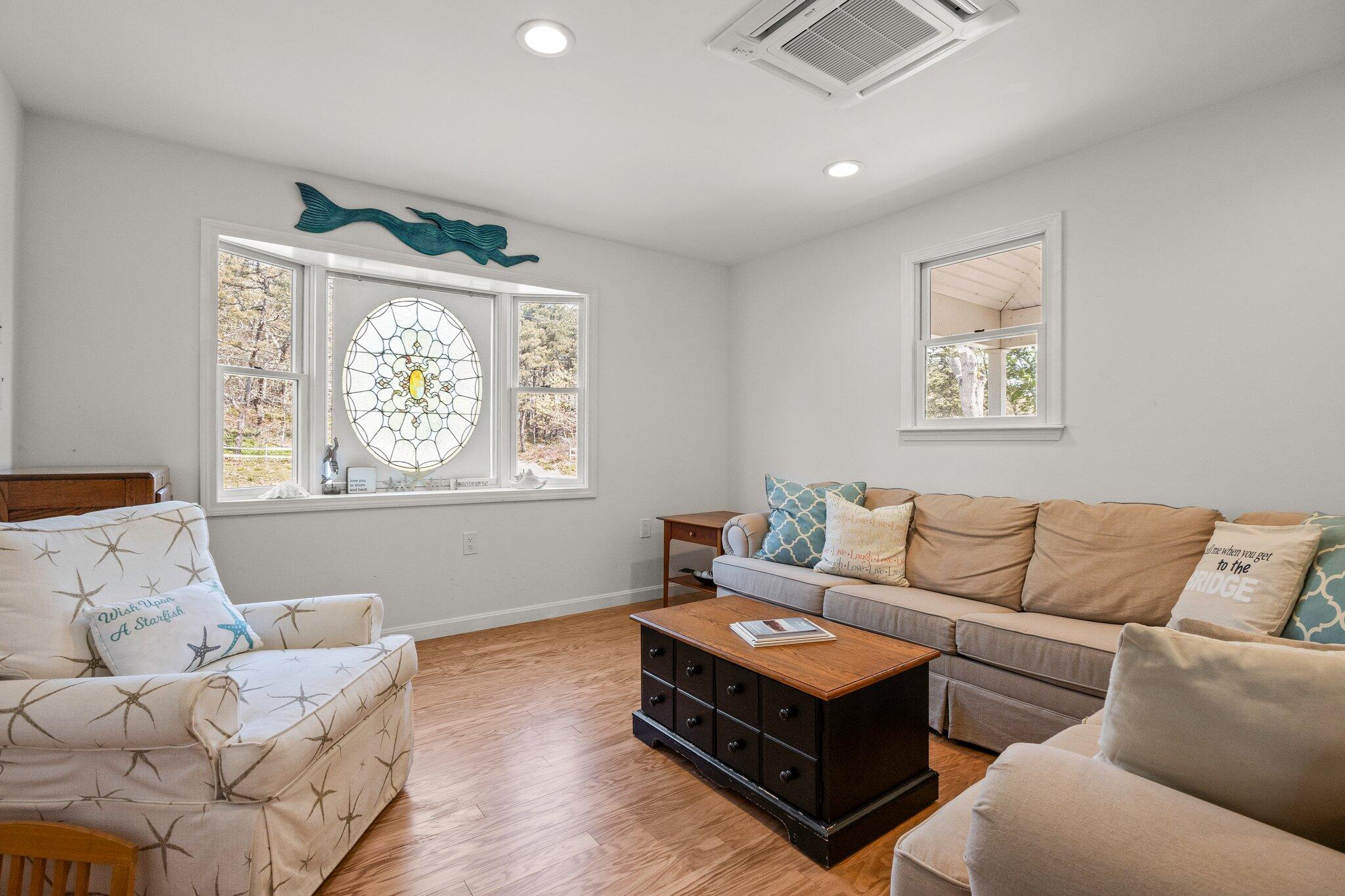19 South Highland Road Truro, MA 02666 - Photo 5 of 45 a living room with furniture and a window