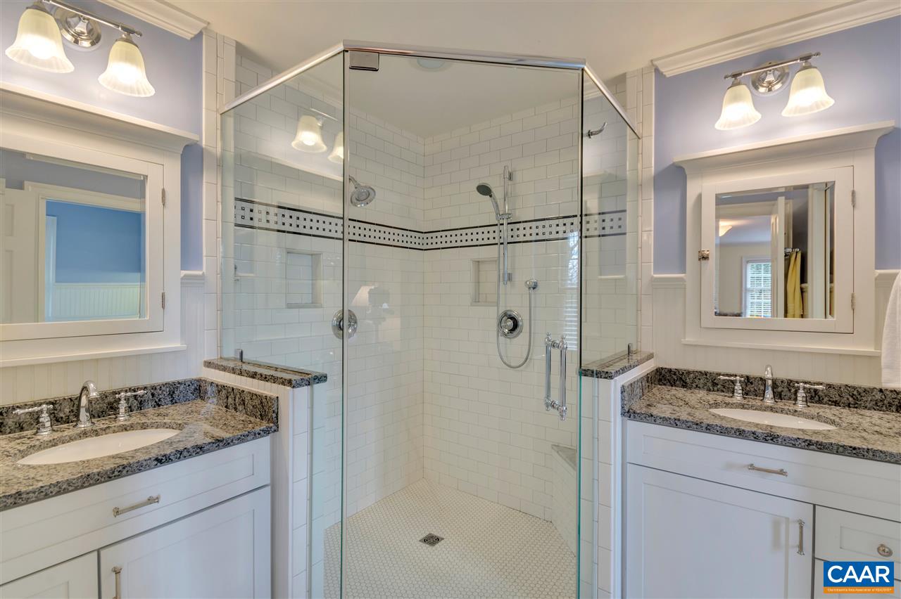 1442 Grove Road Charlottesville, VA 22901 - Photo 18 of 31 a bathroom with a granite countertop sink mirror and shower