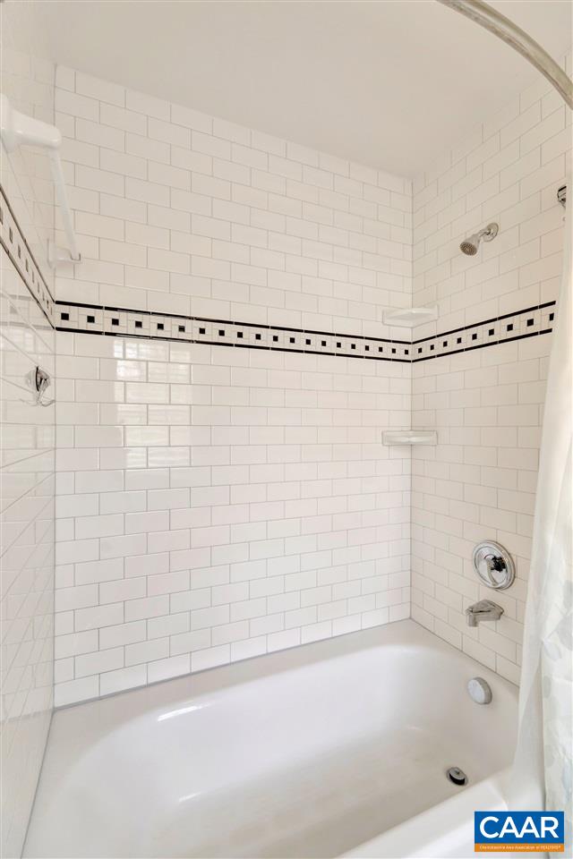1442 Grove Road Charlottesville, VA 22901 - Photo 24 of 31 a bathroom with a bathtub and a shower