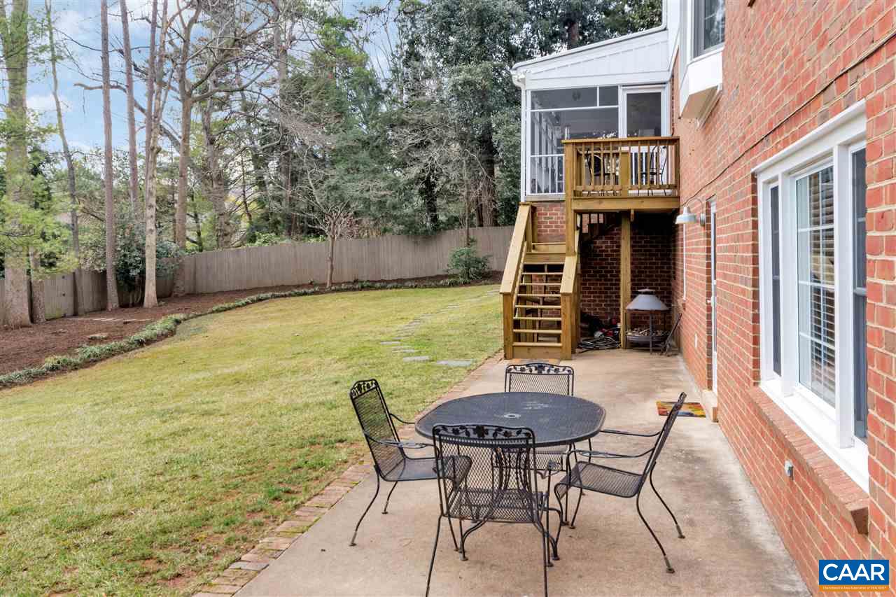 1442 Grove Road Charlottesville, VA 22901 - Photo 30 of 31 a view of a patio with table and chairs with wooden floor and fence