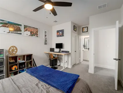a bedroom with furniture and a window