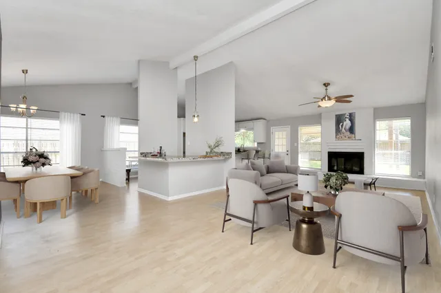 a living room with fireplace furniture and a fireplace