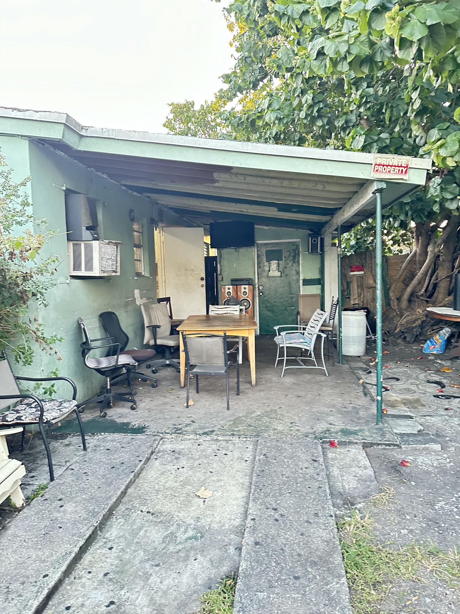 116 Southwest 11th Avenue Delray Beach, FL 33444 - Photo 2 of 10 a view of a dinning table and chair in the patio