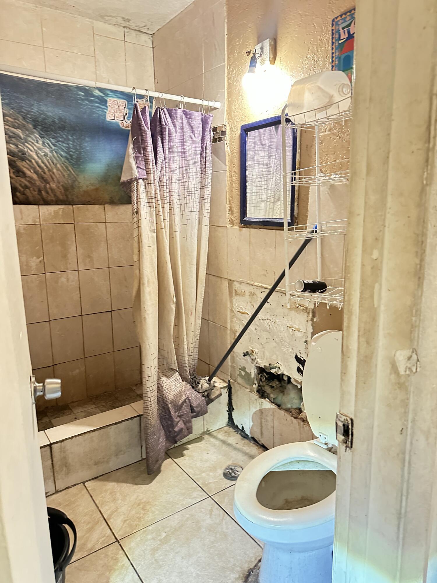 116 Southwest 11th Avenue Delray Beach, FL 33444 - Photo 10 of 10 a bathroom with a sink and a shower