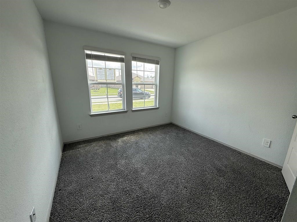 6710 Riplee Street Beaumont, TX 77708 - Photo 11 of 15 an empty room with a window