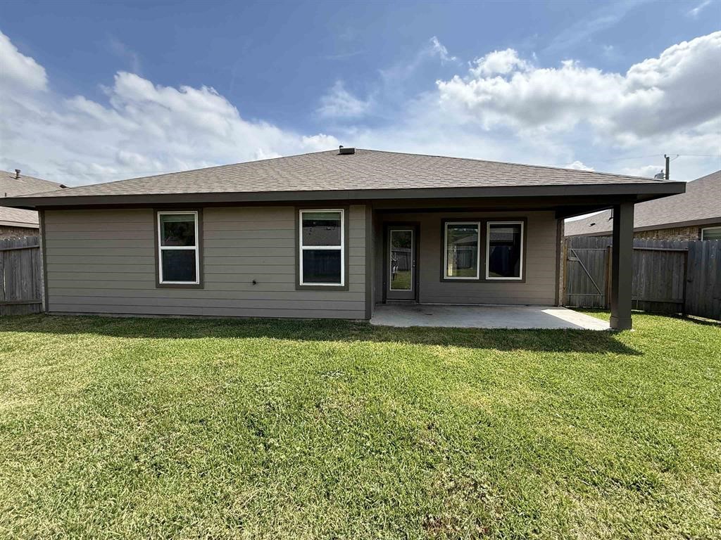 6710 Riplee Street Beaumont, TX 77708 - Photo 14 of 15 a front view of a house with garden