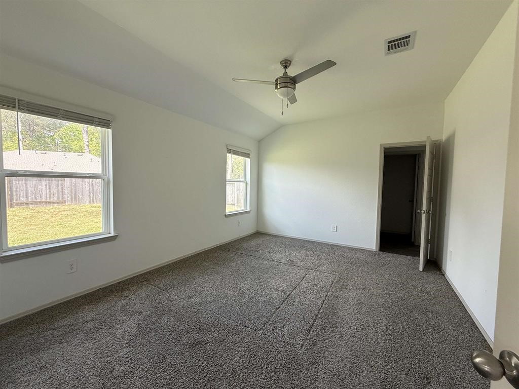 6710 Riplee Street Beaumont, TX 77708 - Photo 10 of 15 a view of an empty room with a window