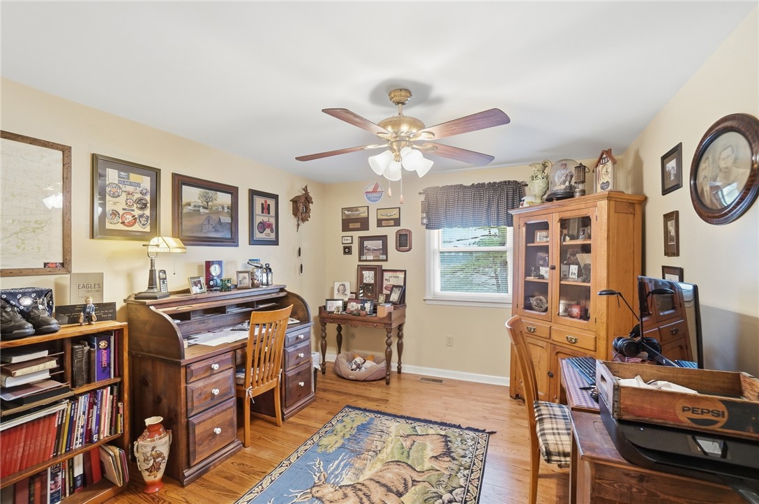 4170 Johnson Road Springfield, OH 45502 - Photo 46 of 54 An inviting study features gleaming hardwood flooring and a functional ceiling fan.