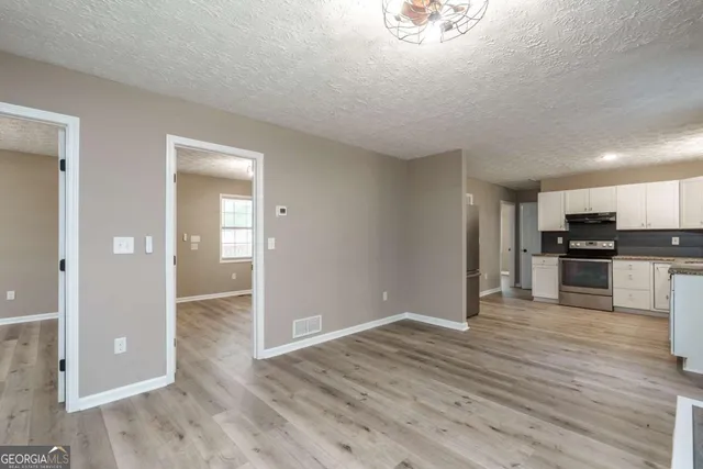 a view of kitchen with wooden floor